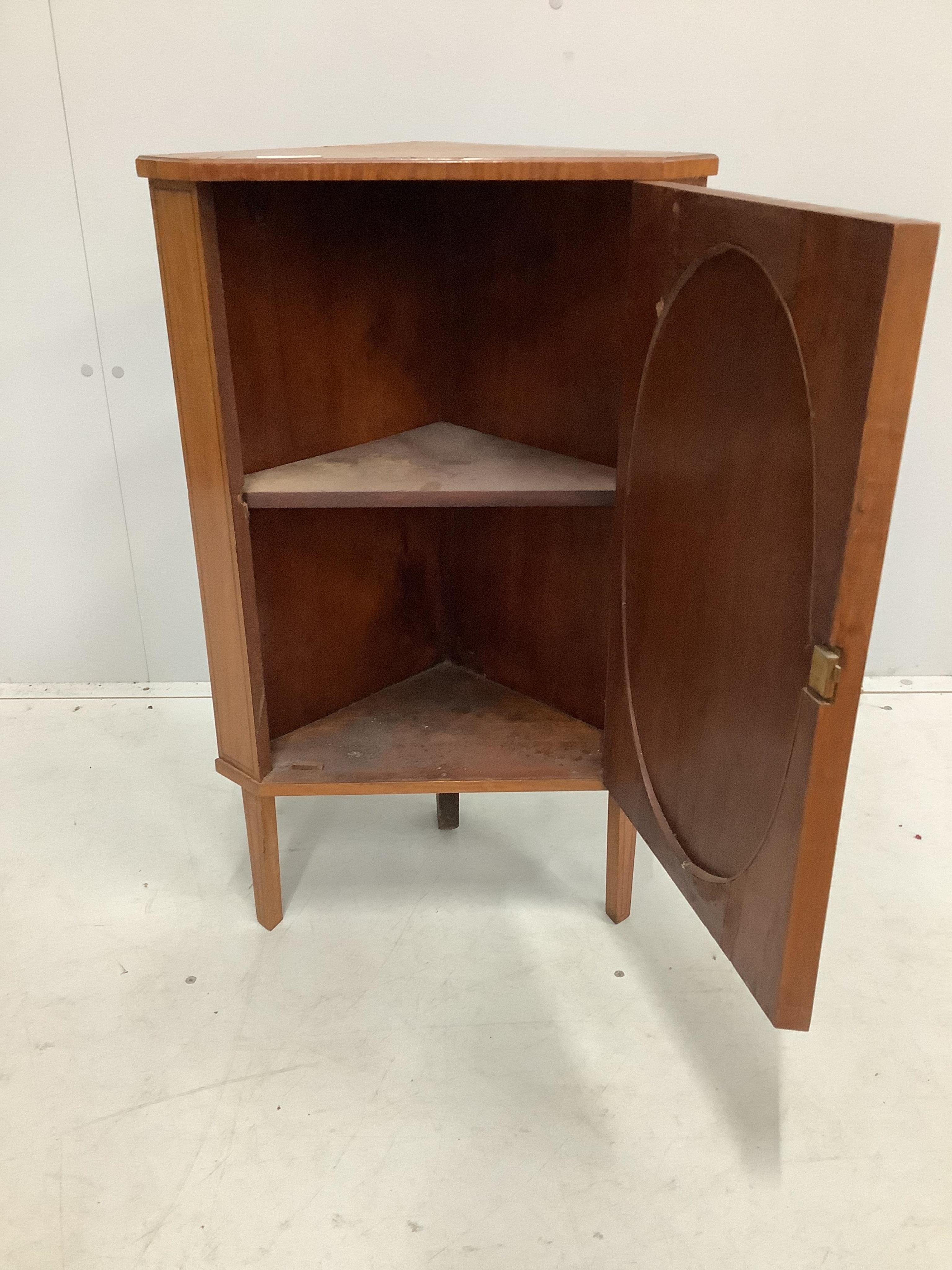 A small Edwardian satinwood corner cabinet, width 48cm, depth 29cm, height 77cm. Condition - poor to fair